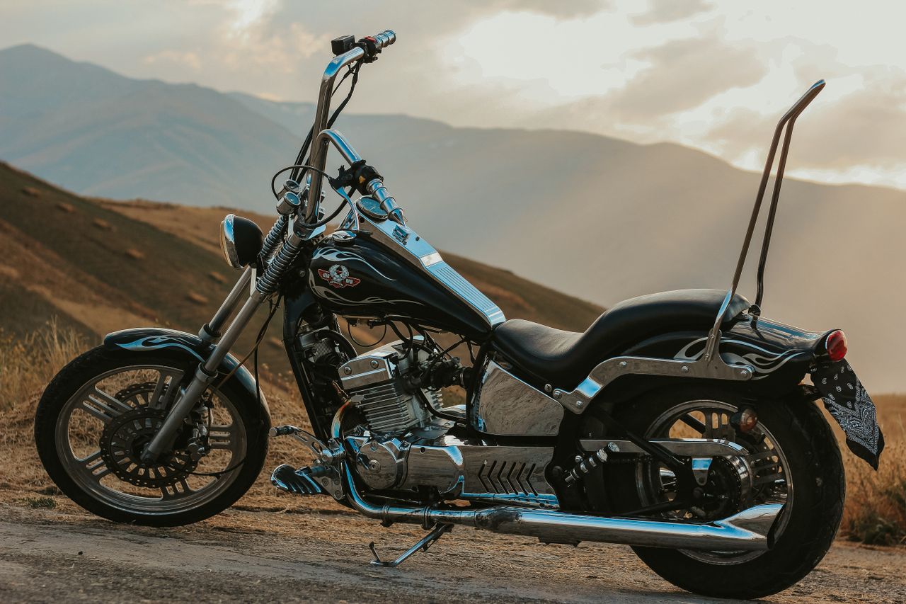 services-03 Custom chopper motorcycle parked in a scenic mountainous area in West Azerbaijan, Iran.