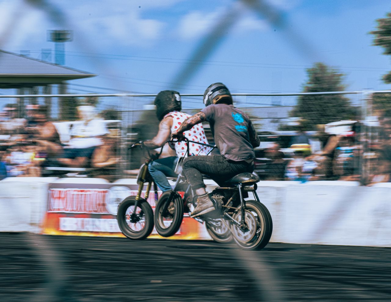 gallery-6 Dynamic motorbike race scene with focused blur, exuding speed and thrill.